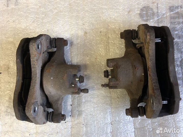 Суппорт тормозной передний Mitsubishi Lancer 10