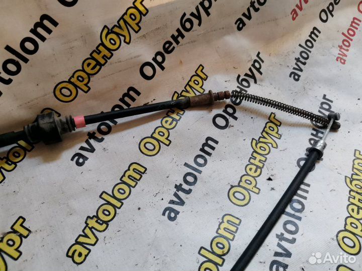 Трос ручного тормоза левый Mitsubishi Lancer 10