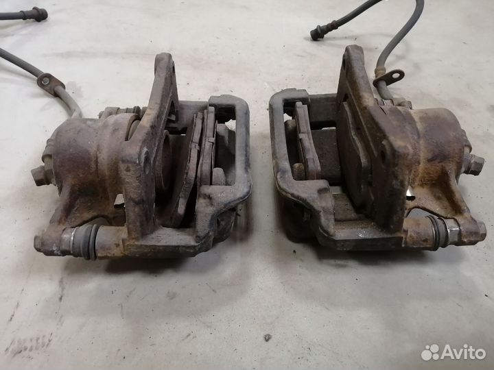 Суппорт тормозной передний для Toyota Corona ST190