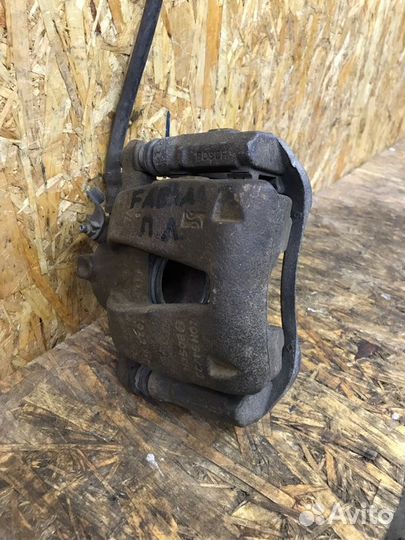 Суппорт тормозной передний левый Skoda Fabia 2