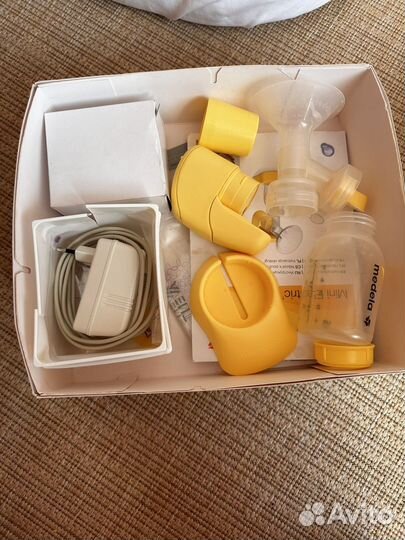 Молокоотсос medela электрический