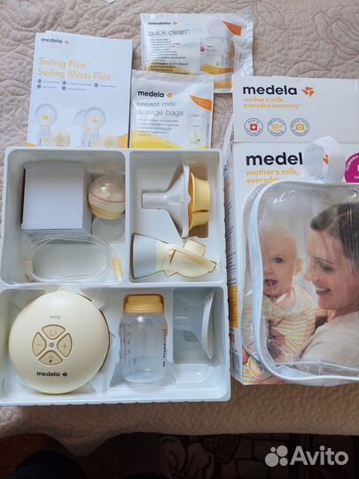 Молокоотсос medela электрический