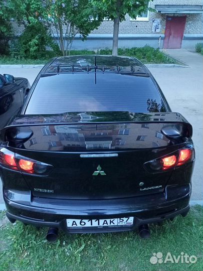 Задний бампер lancer 10 с эво накладкой