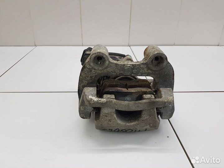 Суппорт задний левый (Chery Tiggo 7 Pro)