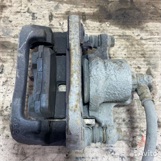 Суппорт задний левый Mazda CX-7 (ER) 2006-2012г ER