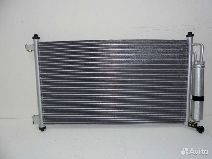 Радиатор кондиционера Ниссан Тиида 2004-2014