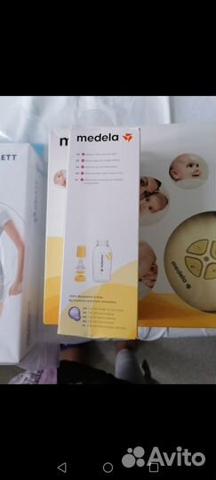 Молокоотсос medela электрический