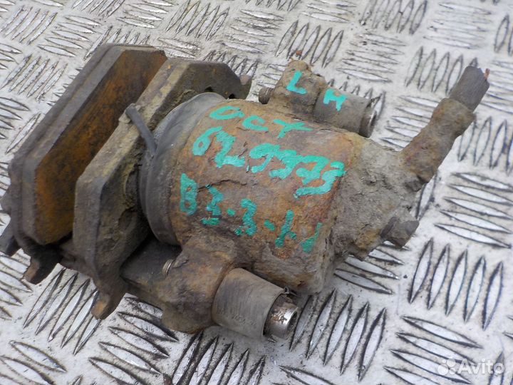 Суппорт тормозной передний левый Skoda Octavia 200