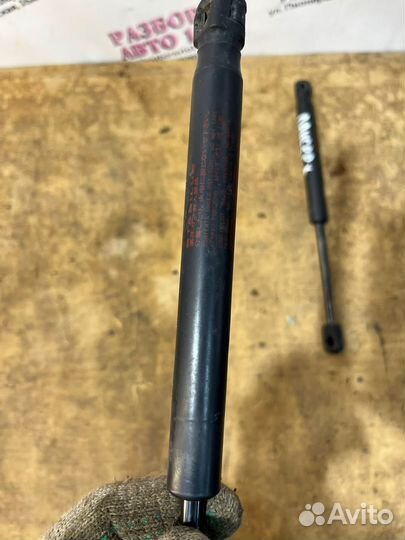 Амортизатор крышки багажника Mitsubishi Lancer 10