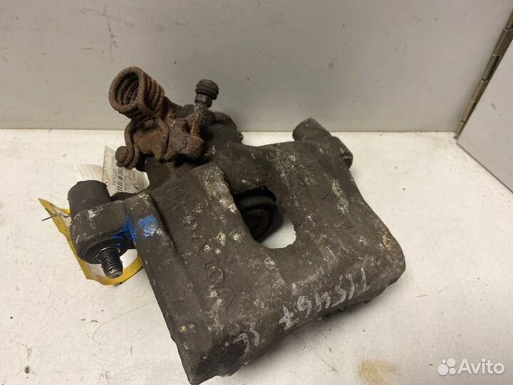 Суппорт тормозной задний левый Ford Focus Ii