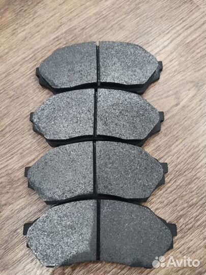 Тормозные колодки передние mazda familia BJ 2002