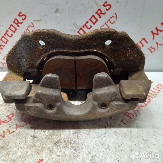 Суппорт тормозной передний левый Mazda Premacy CW