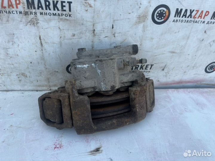 Суппорт тормозной передний левый Chevrolet Niva