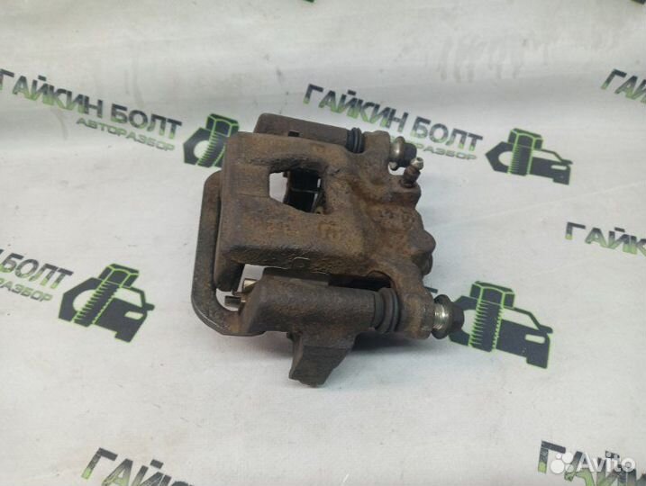 Суппорт тормозной задний правый Nissan Qashqai J10