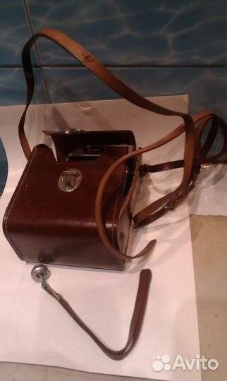 Кинокамера 1960-х годов и фотоальбом