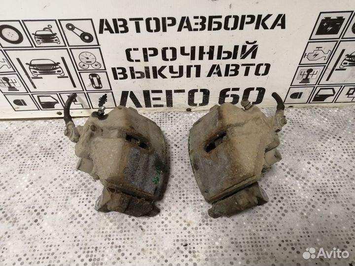 Суппорт тормозной передний VW Passat B6