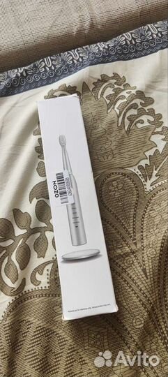 Электрическая зубная щётка