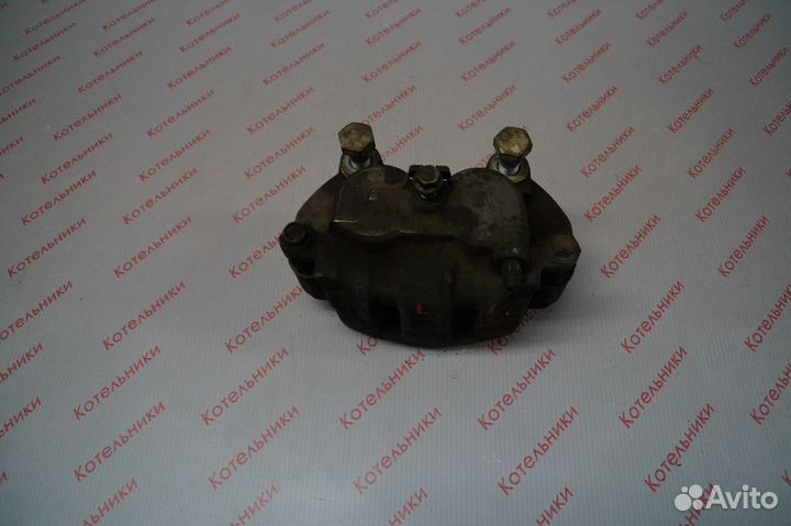 Nissan 41011-WF100 Суппорт тормозной левый