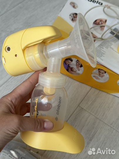 Молокоотсос medela электрический