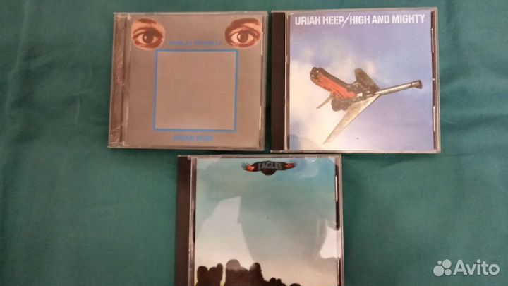 Компакт диски Eagles и Uriah Heep