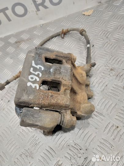 Суппорт тормозной передний левый Mitsubishi Pajero