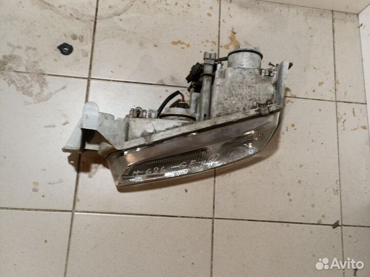 Фара левая mazda 626 ge