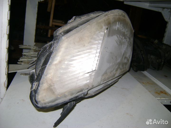 Фара передняя левая Mitsubishi L200 KB