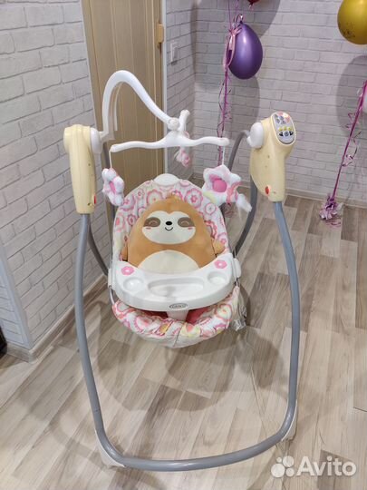 Электрокачели Graco с музыкой и столиком