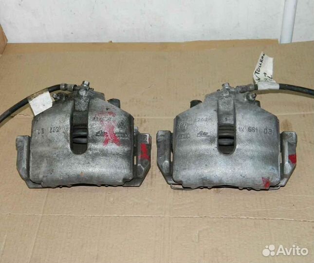 Суппорт передний левый/правый VW Touran