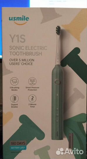 Электрическая зубная щетка