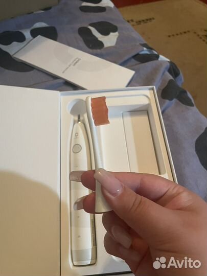 Электрическая зубная щетка