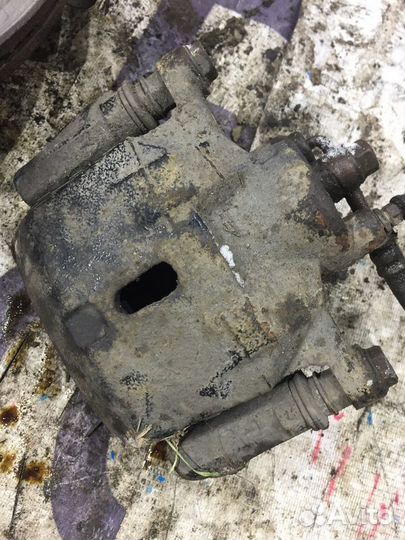 Суппорт тормозной передний левый Geely MK