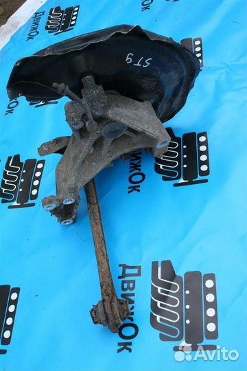 Кулак поворотный задний левый VW Passat B6