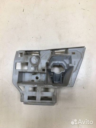 Кронштейн форсунки омывателя фар левый