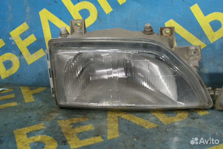 Передняя фара Ford Escort