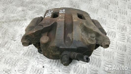 Суппорт тормозной передний левый nissan navara D40