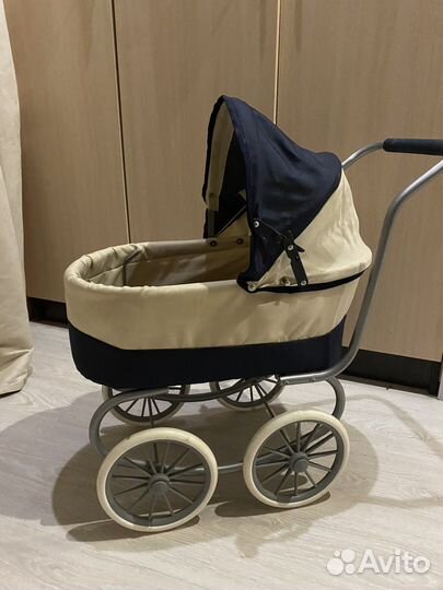 Игрушечная коляска для кукол