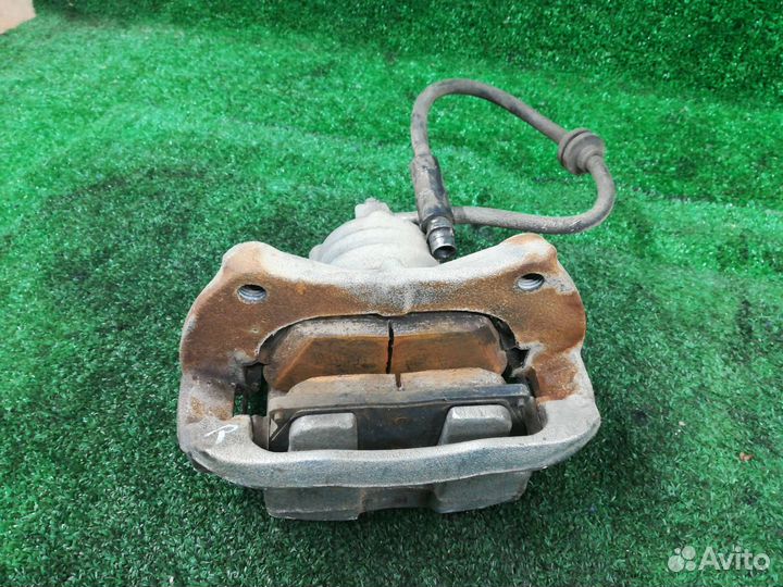 Суппорт тормозной передний правый Chevrolet Tracke