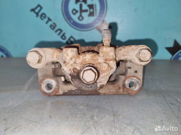 Суппорт тормозной задний правый Nissan Qashqai J10