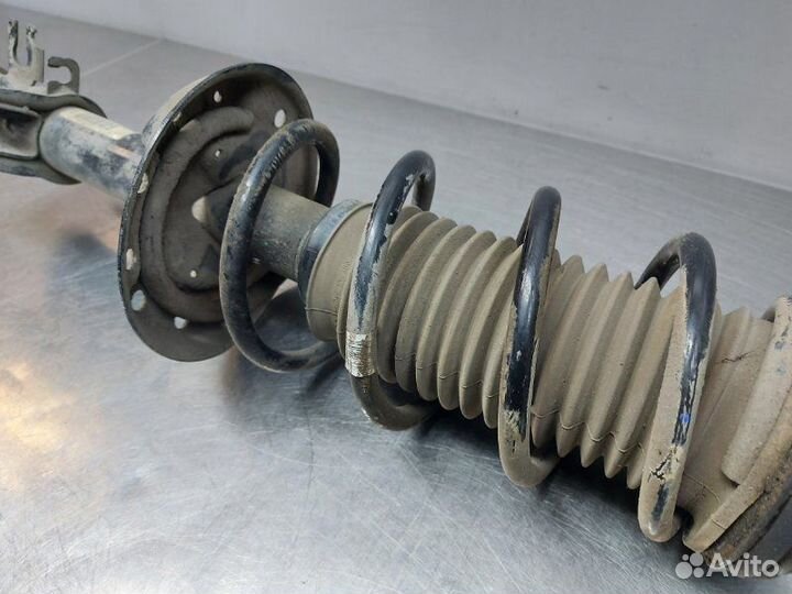 Стойка амортизатора передняя левая Opel Corsa D