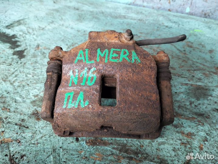 Суппорт тормозной передний левый Nissan Almera