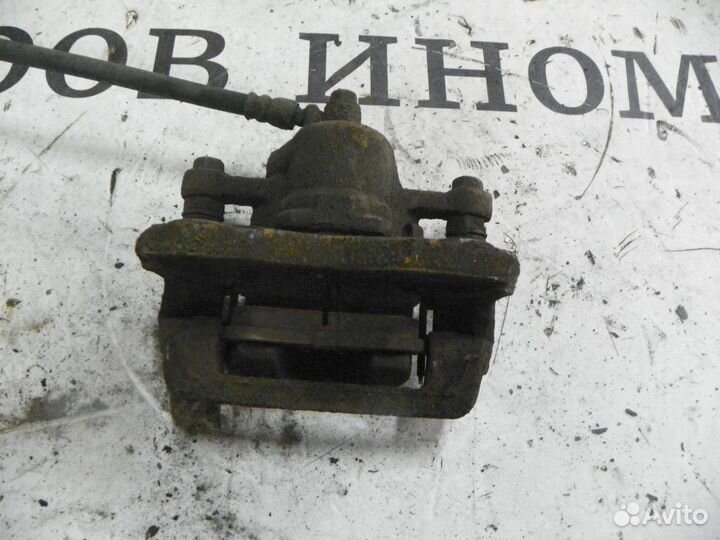 Суппорт тормозной задний левый Kia Sportage II (20