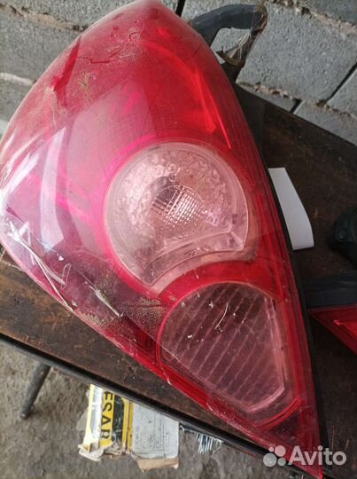 Оптика фары Стоп сигнал Nissan Tiida c11