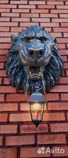 Барельеф голова льва