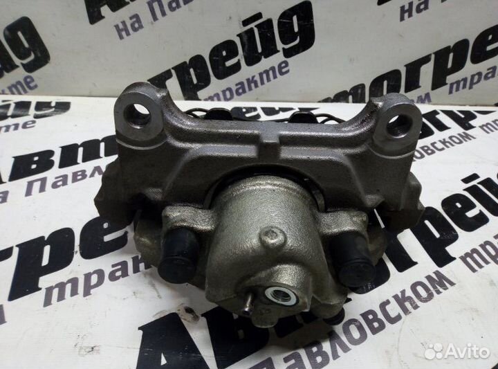 Суппорт тормозной передний левый Volkswagen Passat