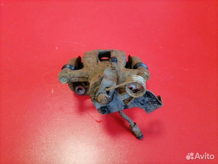 Суппорт задний левый Hyundai Solaris RB G4FC 2012