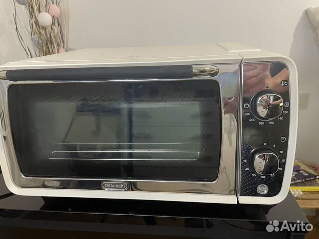 Мини-печь DeLonghi новая