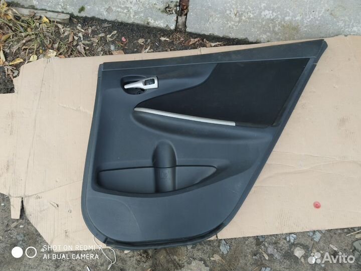 Обшивка двери задняя правая Toyota Corolla 150