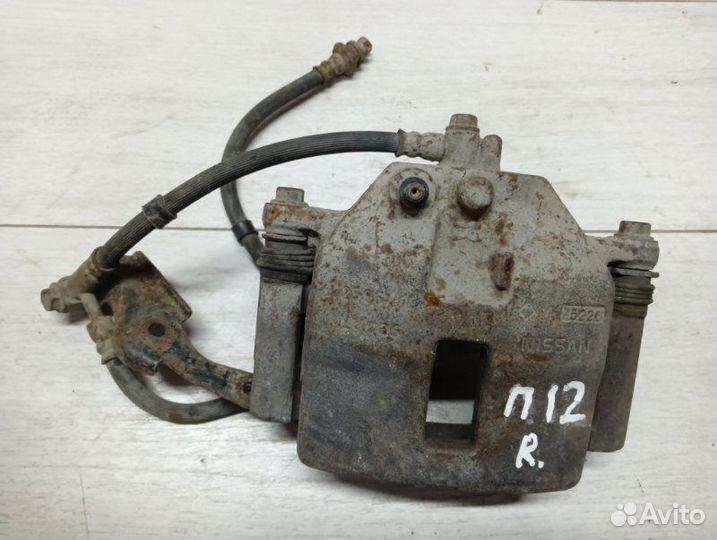 Суппорт тормозной передний правый Nissan Ниссан