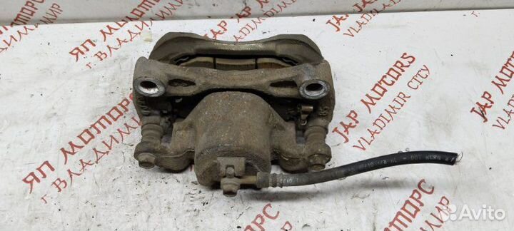 Суппорт тормозной передний левый Nissan Teana